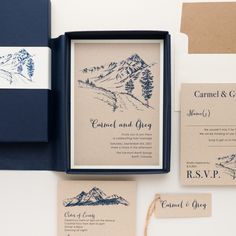 the wedding stationery is laid out on top of each other