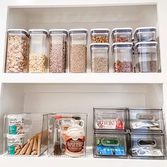 an organized pantry with clear containers and food items on the shelves, including cereals