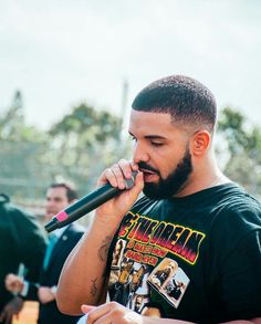 a man holding a microphone up to his mouth