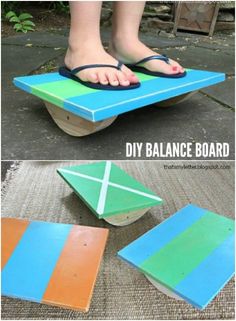 a person standing on top of a wooden table with different colors and shapes painted on it