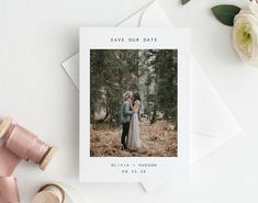 an image of a couple standing in the woods with their wedding date printed on them