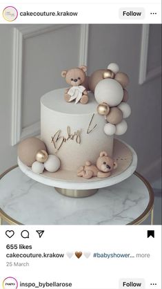 a white cake with teddy bears on top