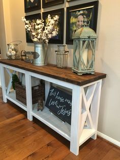 a white shelf with some pictures on it