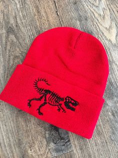 Welcome to my shop! If you know a child that loves dinosaurs this beanie is for you! Its embroidered with high quality thread and can be customized! It has a T-Rex embroidered right on the front of the hat! Its a one size fits most! If you have any questions please send me a message! Thank you for stopping by! Warm Novelty Beanie, One Size Fits Most, Novelty Warm Beanie, One Size Fits Most, Novelty Warm Beanie One Size Fits Most, Warm Novelty Beanie One Size Fits Most, Warm Novelty Beanie, Novelty Cap Beanie One Size Fits Most, Novelty One Size Fits Most Cap Beanie, Novelty One-size-fits-most Beanie Cap, Adjustable Novelty Beanie Cap