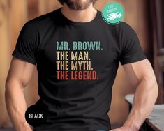 a man wearing a t - shirt that says mr brown the man, the legend