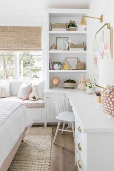 a bedroom with white walls and shelves filled with books, toys, and other items