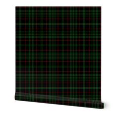 a black and green plaid wallpaper with red and green squares on it's sides