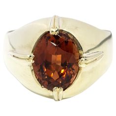 From the era of disco, punk and soul comes our Billie Ring. Crafted in 14 carat gold, her opulent orange sapphire rests atop her high-polish domed band. A truly wonderful memory of a time rich in colour and fashion, perfect for your someone special. The Billie Ring Gem Details The oval deep orange tourmaline measures 11.60x8.50 millimetres. Note: there is light surface wear consistent with the age of the ring Ring Size T 1/2 (Australia and UK sizing) or 10 (US and Canada) The Billie Ring can be Disco Punk, Musica Disco, Deep Orange, Orange Sapphire, Tourmaline Stone, Cabochon Ring, Pave Ring, Domed Ring, Vintage Band