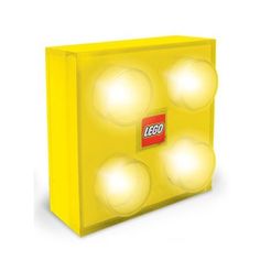 the lego light is yellow and has four lights on it's sides, with three small