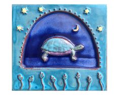 a ceramic tile with a turtle on it's back and stars in the sky