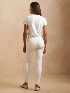 SKINNY FIT: A high-rise skinny jean with perfectly placed back pockets and a curved waistband to fit and flatter.  ITALIAN DENIM: Our sheer-proof white jeans with beige pockets (so they won't show through), this denim from Italy's Candiani mill is lo Fitted White Bottoms For Everyday, Fitted Cream Jeans With Five Pockets, Fitted Cream Jeans, Chic Cream Fitted Jeans, Chic Fitted Cream Jeans, White Casual Jeggings For Spring, White Fitted Jeans For Everyday, Fitted Cream Bottoms For Everyday Wear, Trendy Fitted Cream Jeans