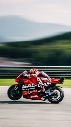 a person riding a motorcycle on a race track