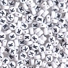 many white and black beads with letters on them