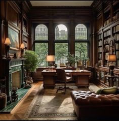 a living room filled with lots of books and furniture next to a window covered in windows