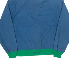 Item is in good used condition. >Size: L >Armpit To Armpit: 24" >Armpit To Cuff: 19" >Collar To Hem: 25" Retro Blue Windbreaker For Streetwear, Blue Retro Windbreaker For Streetwear, 90s Blue Windbreaker For Streetwear, 90s Style Blue Track Jacket For Outdoor, Blue Retro Windbreaker For Outdoor Activities, Vintage Blue Windbreaker For Outdoor Activities, Casual Blue Windbreaker For Streetwear, 90s Style Hooded Blue Windbreaker, Blue Cotton Windbreaker With Pockets