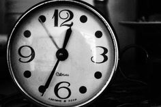 a black and white photo of a clock with the numbers six o'clock on it