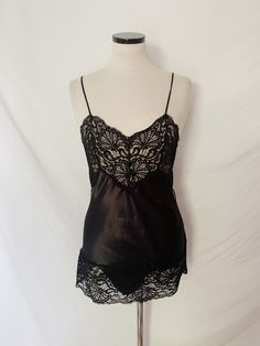 Vintage Victoria's Secret gold label black lace nightie, NWT. Body is a satin-like polyester, trimmed with lace. Snap closure at crotch. Tagged size small-- see measurements below: Pit to pit: 15" Natural Waist: 28" Length: 21.25"  *taken from crotch to top of back Bethany Beach, Gold Labels, Womens Bodysuit, Catsuit, Snap Closure, Black Lace, Victoria's Secret, Satin, Trim