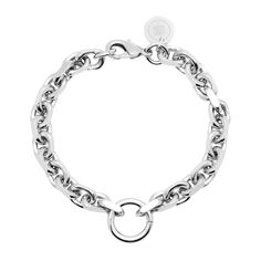 The Gigi bracelet is made from thick brass link chain and fastened with a with lobster clasp with a ring as an accent piece. Material: Brass Plating: 10K Gold or Rhodium-silver Bracelet has a clear protective coating to prevent from quick wear and tarnishing. Chain measures: 6.5mm wide Each link measures: 9.8mm long x 6.5mm wide x 2.1mm thick Accent ring measures: 16mm outer diameter Clasp Measures: 15mm long Available in the following Lengths: 6.5", 7", 7.5", 8", 8.5", 9" Our jewelry is always Cross Selling, Sustainable Materials, Sale Event, 10k Gold, Custom Engraving, Link Chain, Accent Pieces, Watch Bands, Lobster Clasp