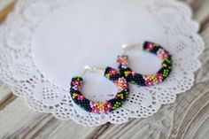 "Matching necklace https://www.etsy.com/listing/523093199 Beaded hoop earrings! They will be a wonderful accessory for any of your style! READY TO SHIP! The diametrs are: 1.5\" (3.8 cm) 1.7 \" (4.3 сm) 1.9 \" (4.8 cm) 2.2 \" (5.5 cm) ❤ CUSTOM ORDERS It is ABSOLUTELY HANDMADE . So if you like this item in a different color or size, send me a message please. I will send you a link for a \"custom order\" and you'll be able to place the order there. Please feel free to communicate with me. SHIPPING Handmade Bohemian Flower Hoop Earrings, Bohemian Handmade Flower Hoop Earrings, Bohemian Flower Shaped Handmade Hoop Earrings, Bohemian Blue Beaded Round Earrings, Blue Round Bead Hoop Earrings Gift, Bohemian Blue Hoop Earrings With Colorful Beads, Adjustable Black Hoop Earrings With Colorful Beads, Nickel-free Pink Beaded Hoop Earrings, Romantic Embroidery