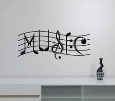 a wall decal with music notes and musical staffs on it's side