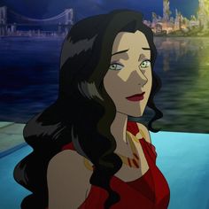 a woman in a red dress standing next to a body of water with a castle in the background