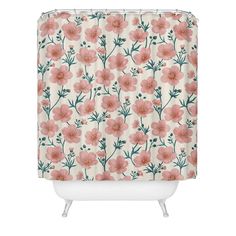 a shower curtain with pink flowers and green leaves on it, against a white background