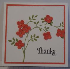 a thank card with red flowers and the words thanks written on it's side