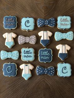 baby shower cookies decorated with blue and white fondant, bow tie, monograms