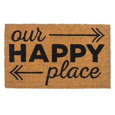 a door mat with the words our happy place on it and an arrow pointing up