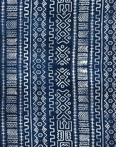 a blue and white rug with different designs on the front, side, and back