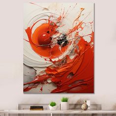 an orange and white abstract painting on a wall in a living room with a table