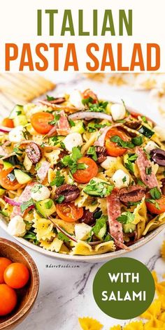 pasta salad with tomatoes and other vegetables in a bowl