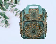 a green and brown backpack sitting next to a leafy plant on a white surface