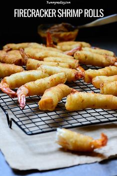 fried shrimp sticks cooling on a wire rack