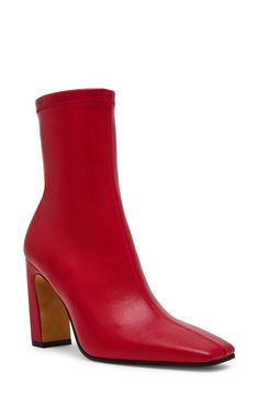 A squared-off toe and slender block heel balance a versatile bootie fashioned with a side zipper for easy entry. 3 1/2" heel Side zip closure Synthetic upper/textile lining/synthetic sole Imported Red Fitted Heeled Boots With Square Toe, Red Ankle Boots With Zipper Closure, Fitted Bold Heeled Boots With Round Toe, Bold Fitted Heeled Boots With Round Toe, Red Fitted Square Toe Heels, Bold Fitted Heeled Boots For Fall, Fitted Red Square Toe Heels, Red Square Toe Heels For Fall, Modern Red Boots For Fall