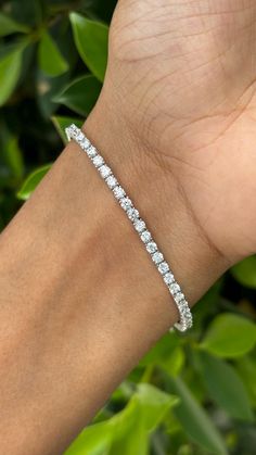 This is one of our most beloved and beautifully handcrafted lab diamond bracelet. This bracelet is studded with 2.89 carat Lab Diamonds that are round-cut and are of F/G Color and VS Clarity. The bracelet is set in 5.98 grams 18K White Gold. The lab-grown diamonds used in this bracelet are created using advanced Chemical Vapor Deposition (CVD) technology, a process we proudly specialize in. These diamonds possess the same physical, chemical, and optical properties as diamonds, ensuring they sparkle with unparalleled brilliance and radiance. Each CVD diamond reflects light beautifully, creating a dazzling display that is indistinguishable from that of natural diamonds. This bracelet is a celebration of both beauty and ethical craftsmanship. Lab-grown diamonds offer a sustainable and environ Prom Outfit, 18k Gold Bracelet, Gold Armband, Cvd Diamond, Diamond Tennis Bracelet, Prom Outfits, Tennis Bracelet Diamond, Tennis Bracelet, Lab Diamonds