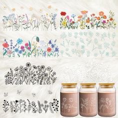 three jars with flowers painted on them sitting next to each other in front of a white fur background