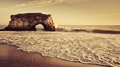 an image of the ocean with a rock formation in the foreground that says tell my servants