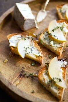 slices of bread with cheese and herbs on them