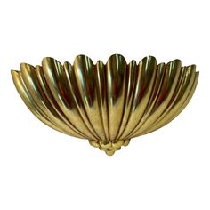 a large brass bowl shaped like a flower