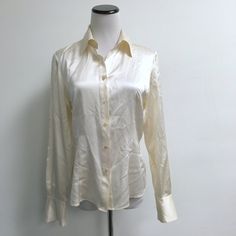 Brooks Brothers Cream 100% Silk Shirt/ Top..Size 6..4 Button Cuff..Classic! Sorry About The Wrinkles Its Been Packed Away..Beautiful Shirt! Condition: Excellent Measures Bust 38 Length 25 Classic Fitted Blouse With Button Closure, Fitted Cream Tops With Button Cuffs, White Fitted Silk Shirt, Fitted White Silk Shirt, Designer Fitted Button-up Shirt, Classic Fitted Silk Blouse, Formal Cream Shirt With Button Cuffs, Fitted Long Sleeve Silk Shirt, Fitted Classic Silk Shirt