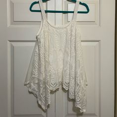 Nwt Xhilaration By Target Top. Size Medium. Off-White Sleeveless Top. No Rips Tears Or Pulls. Comes From A Pet Friendly And Non-Smoking Home. White Stretch Tank Top With Lace Detail, White Stretch Lace Tank Top, White Lace Tank Top For Day Out, White Lace Tank Top For Spring, Casual White Lace Tank Top, White Tank Top For Festivals, White Festival Tank Top, White Bohemian Tank Top For Spring, White Stretch Festival Top