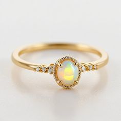 Opal ring for women gold, sterling silver opal ring vintage opal ring white gold, opal jewelry Opal Ring for Women - Vintage Gold and Sterling Silver Opal Jewelry Description: Elevate your style with our exquisite Handmade Opal Ring for Women, meticulously crafted to capture the timeless allure of opals. Available in both classic sterling silver and elegant gold, this vintage-inspired piece is a true testament to opal's natural beauty. Specifications: Material: Solid 925 sterling silver / Gold P Fine Jewelry Gold Opal Birthstone Ring, Vintage Opal Ring As A Gift, Elegant Opal Jewelry With Cabochon, Elegant Opal Cabochon Jewelry, Elegant Gold Opal Ring, Gold Opal Birthstone Ring, Gold Opal Promise Ring In Fine Jewelry Style, Gold Opal Ring With Birthstone, Opal Birthstone Jewelry For Promise Ring