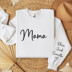 Enjoy this personlized mama sweatshirt with kids names on sleeve.  Perfect mothers day gift.  Fully Customizable   All sweatshirts, Hoodies and TShirts are UNISEX.   Due to the nature of this product I am unable to accept returns or exchanges.  All items are made to order once order is placed.  Please make sure your order is accurate before placing order. SHIPPING AND PROCESSING TIMES  US ORDERS: "Standard" shipping delivers within 2 weeks* from the order date. *Please note that holidays may res Crafts Cricut, Cricut Tips, Kids Names, Mom Life Shirt, Embroidered Crewneck, Mama Sweatshirt, Mom Sweatshirt, Happy Women, Tips Tricks