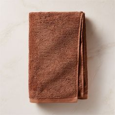 two brown towels folded on top of each other