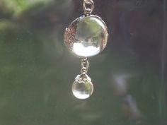 this is a beautiful vintage quartz rock crystal orb  approx 14mm set in a sterling floral wrap  the crystal is clear  with a rock crystal drop  and a sterling silver plated chain that i added Magic Potions, Crystal Orb, Quartz Rock, Floral Wraps, Crystal Drop, Rock Crystal, Sterling Silber, Floral Motif, Pendant Necklaces