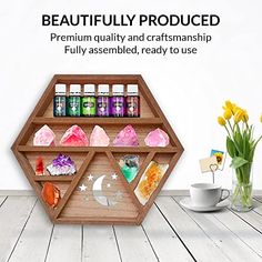 a wooden shelf filled with lots of essentials next to a cup and vase full of flowers