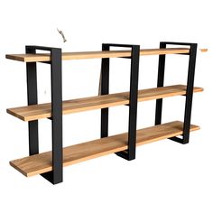 three wooden shelves with black metal legs and one shelf has two birds perched on top