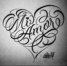 a heart with the word love written in cursive writing on top of it