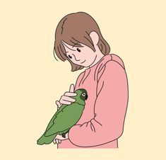 a woman holding a green bird in her hands